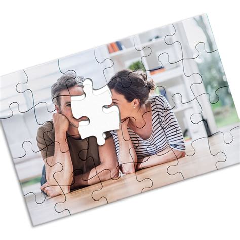 Make a picture into a puzzle. Step 1. Place your poster board on a flat surface with the gloss side facing up. Decide the approximate size of your puzzle pieces by inches, such as 1-by-1-inch or 2-by-2-inch pieces. The larger the pieces the easier the puzzle is, so consider the age group of the people who will be working the puzzle. Video of the Day. 