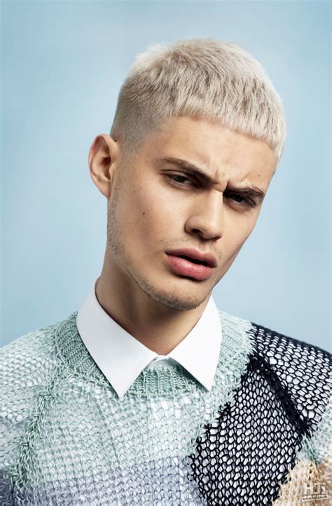 Male hair bleach. Stylish Platinum Blonde Makeover. A trendy silver hairstyle creates a sharp contrast with … 