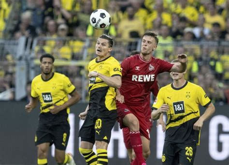 Malen scores after canceled substitution for Dortmund to start Bundesliga with win over Cologne