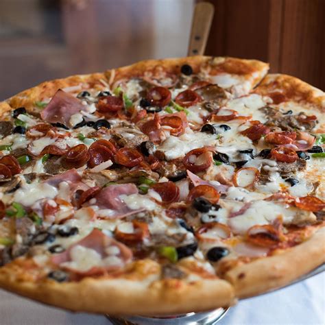 Mama lucias. Mamma Special $17.99. Pepperoni, sausage, ham, mushrooms, onions, green peppers. White Pizza $16.99. Spinach and ricotta cheese. Tomato White Pizza $16.99. Ceasar tomatoes and ricotta cheese. Broccoli White Pizza $16.99. Broccoli and ricotta cheese. Gluten-Free Veggie Pizza (10") $12.49. 