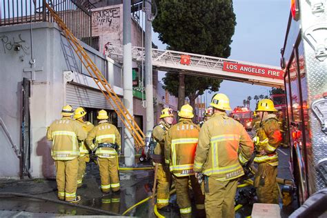 Man, woman seriously injured in 'city-block-sized' fire in South Los Angeles