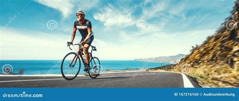 Man Adult on a racing bike climbing the hill at mediterranean sea ...