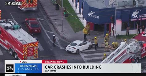 Man and woman injured after crash causes car to run into Van Nuys restaurant
