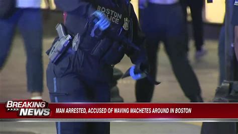Man arrested, accused of waving machetes in Boston