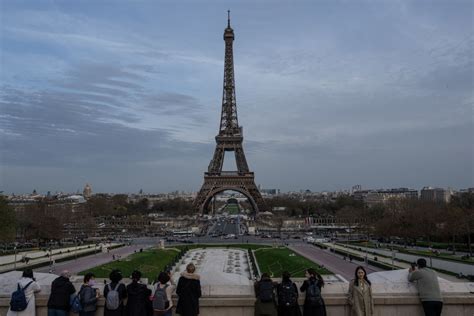 Man arrested after jumping off Eiffel Tower with a parachute