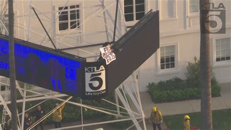 Man climbs KTLA radio tower holding 'Free Billie Eilish' sign