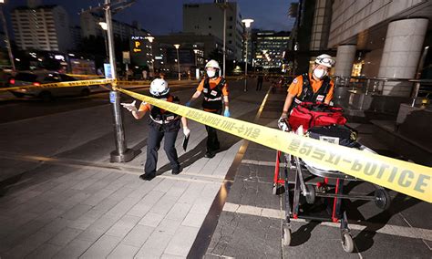 Man rams car onto sidewalk in South Korea and stabs people; at least 14 hurt