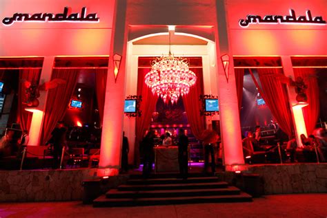 Mandala cancun. Mandala stands out among Cancun's nightclubs due to its oriental-inspired design, open facade, and vibrant atmosphere. With screens scattered throughout, a colorful stage, and a dance floor bustling with partygoers, Mandala Nightclub offers an unforgettable experience. 