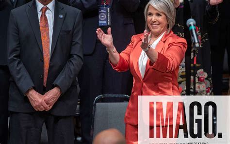 Gov. Michelle Lujan Grisham applauds while standing next to her husband, Manny Cordova, during a public inauguration ceremony on Sunday. The governor is traveling to Washington D.C. this week to. Manny cordova governor