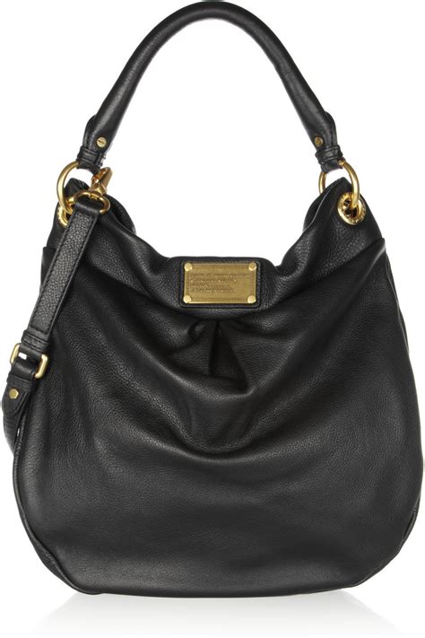 Marc by marc jacobs. J Marc Mini Shoulder Bag. $295.00. Add to Bag. Free shipping on all orders over $50. Color. Description. A mini version of our signature J Marc Shoulder Bag with added functionality and sealed by the J Marc hardware. With three ways to wear, go from formal to casual by swapping the chain shoulder strap with the webbing crossbody strap, or carry ... 