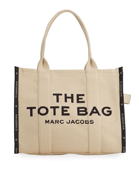 Marc jacobs canvas tote bag. Description. The most classic version of our Small Tote brings style to your every day with a quintessential Marc twist. Crafted from textural cotton canvas, this silhouette is intended to fade and relax over time for an authentically broken-in look that Marc himself loves to wear. A chunky top zip closure makes this bag small but mighty. 