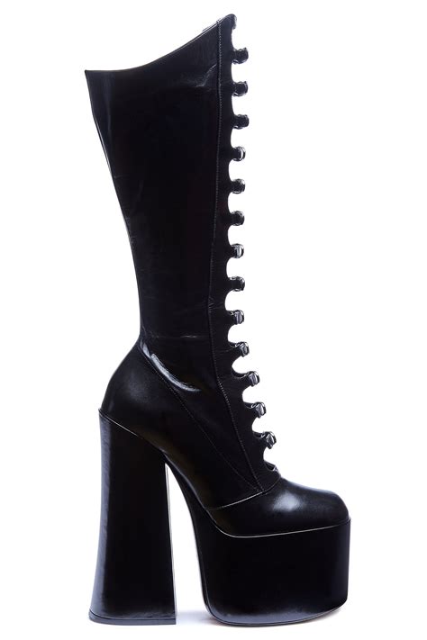 Marc jacobs kiki boots. First debuted on the Fall '16 runway, the original Kiki boots quickly made waves all over the industry. At 6" tall with a 3" platform, the runway icon is reimagined as a knee-length boot and is complete with a rounded toe and the signature multi-straps at front. Shop Marc Jacobs The Kiki Knee-high Boot 