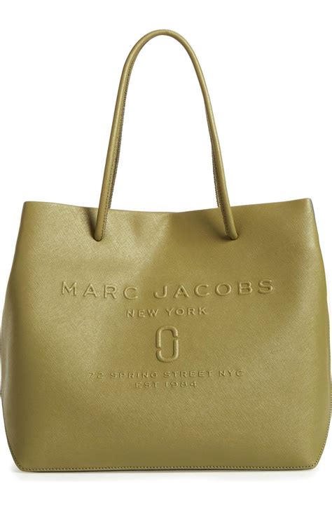 Marc jacobs rack. Marc Jacobs. $54.97. (62% off) $145.00. Free shipping on orders $89+ Exclusions apply. A wrist strap allows you to wear this leather pouch and keep your essential cards and cash at hand. Color: Black. 