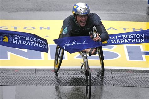 Marcel Hug, Susannah Scaroni win respective wheelchair divisions in 127th Boston Marathon