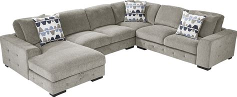 Marcola 4 piece sectional. Create a lively space with the Marcola sectional. Upholstered in soft woven fabric, this piece comes in an ash gray color. Contemporary in style, the sectional features two convenient storage chaises, giving you plenty of room for extra blankets, pillows and more. Sleek track arms and tufted detailing add to the stylish appearance, while the included … 