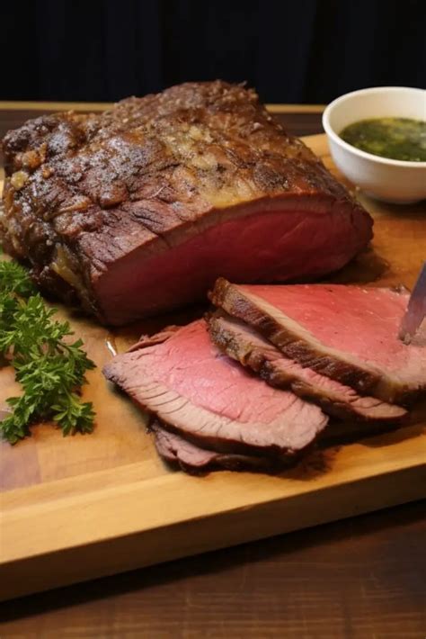 Using the tip of a sharp knife, cut into the roast 1 inch above the bone. Follow the bone, pulling the roast away, and continue slicing the roast into a 1 inch thick sheet. 1 8-10 pound bone-in prime rib roast. Make the garlic and herb stuffing butter. Preheat a large skillet over medium high heat.. 