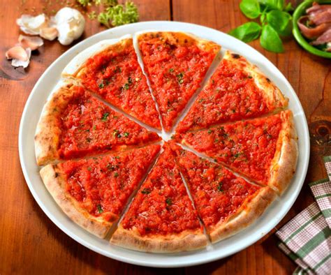 Marinara pizza. A simple yet delicious choice that is sure to satisfy even the most discerning pizza connoisseur! Made with a thin crust and topped with a flavorful tomato sauce, garlic and olive oil, our Marinara Pizza is the perfect combination of simplicity and taste. 