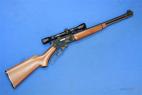 Marlin ~ 336W ~ 30-30 Win. This Marlin Model 336W is a right hand lever action repeating rifle in .30-30 Win. Cal. It has a 20 inch Micro-Groove barrel. A hooded front blade sight and an adjustable notch middle sight. It has a scope rail attached. The butt stock is a checkered grip hardwood pistol grip.. 