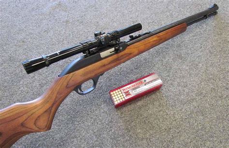 Marlin Model 60SN semi-auto .22LR rifle with 19"heavy barrel and tube fed 14 shot magazine. Adjustable iron sights and 3/8" dovetail receiver rail for scope mounting. Fitted in an SVD style synthetic stock and also supplied with the original standard synthetic stock. A brand new rifle. Scope is NOT included. 