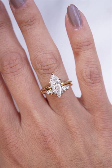 Marquis ring. Read about unique engagement rings. A 3 carat diamond engagement ring is always statement-making. Choosing this carat weight is a bold way of declaring your love. For those with lab-grown diamond Marquise engagement rings, there are certain styling tips to keep in mind for this romantic and playful shape. 