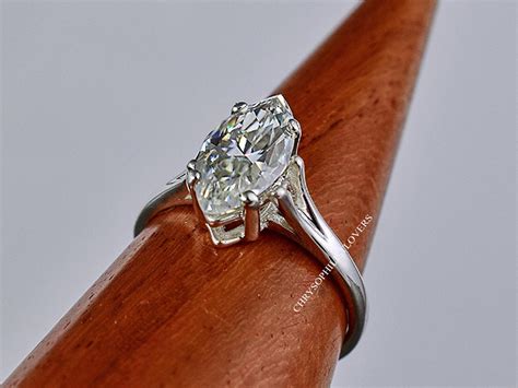Marquise moissanite ring. Marquise Split Shank Moissanite Engagement Ring with Scroll Accents. Solitaire, Antique. I love it, let's build it! Ask A Question. $905.00. 21. enr451-mq. 