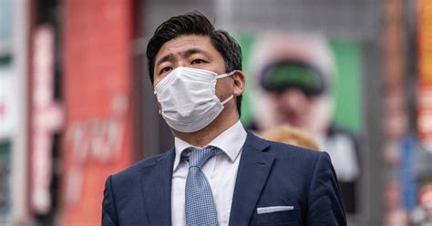 Masks stay put in Japan as 3-year request to wear them ends