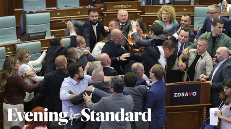 Mass brawl breaks out in Kosovo parliament over Pinocchio picture and water toss