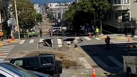 Massive sinkhole forms in SF intersection after water main break