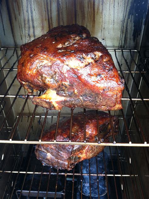 Masterbuilt electric smoker pork shoulder. Place butt on middle rack of smoker and smoke for 7 to 8 hours or until internal temperature reaches 185°F. Remove from smoker. Cover with heavy-duty aluminum foil and return to smoker. Increase smoker temperature to 275°F. Smoke for an additional 2 hours or until internal temperature reaches 200°F. Let meat rest inside foil for 30 minutes. 
