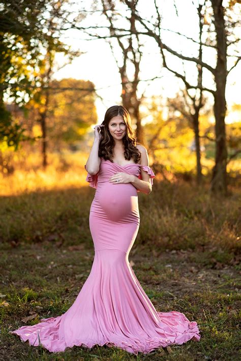 Maternity shoot photography. Let's get into the types of Maternity Gowns for Photoshoot offered by us for your special event-. Maternity sleeve elegant gown. One-shoulder pleated maternity gown. Sweetheart maternity gown with train. Cape maternity gown. Strapless trail maternity gown. V-neck ruffle maternity gown. Lace maternity gown with cape. 