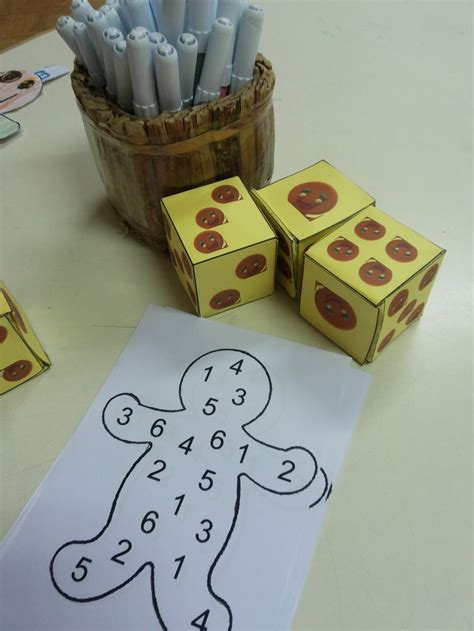 Math Game Roll Gingerbread Man dice and make circle on number that