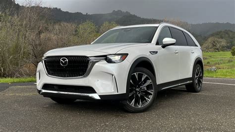Mazda cx-90 review. MotorTrend evaluates the new Mazda CX-90 as a driver's SUV with a turbocharged I-6 or a plug-in hybrid option. However, it also criticizes its small third … 