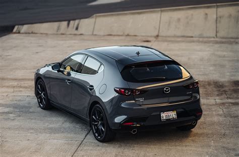 Mazda3 awd. When you hear the phrase “hot hatch”, a brightly colored body kit and a crackling exhaust note usually aren’t far behind. The 2021 Mazda 3 2.5 Turbo Hatchback is a bit of a conundrum then. 