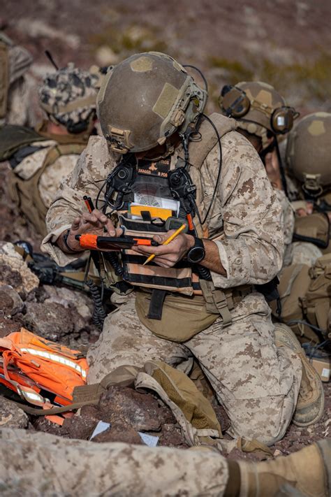 U.S. Marines with 3rd Battalion, 4th Marine Regiment (REIN), 7th Marine Regiment, 1st Marine Division, prepare to be airlifted from Range 230 during Exercise Steel Knight 23.2 at Marine Corps Air-Ground Combat Center, Twentynine Palms, California,... View Details.. 