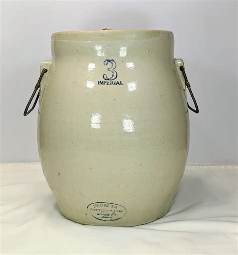 Medalta butter churn. Allow 2 inches of solution to cover eggs. Place jar in a cool, dry place. Jars should be well covered to prevent evaporations. Waxed paper covering tied around top will answer. Do not use same Water Glass solution twice. When boiling preserved eggs make small hole with pin at large end to allow air to escape when heated, to prevent cracking. 