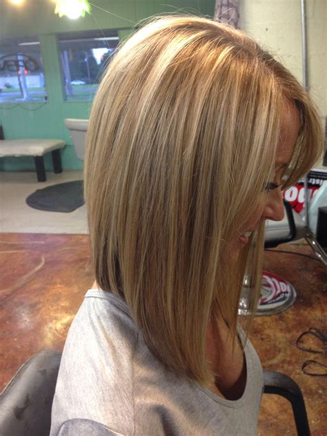 Medium length inverted bob hairstyles. 46. Ombre A-line with Bangs. The sloping angle of this cut makes it a true a-line bob because it’s longer in the front and short in the back with no layers. Instead of ombre, this hairdo uses a balayage (hand painted) technique to achieve the sunny copper colors mid-shaft to ends. 