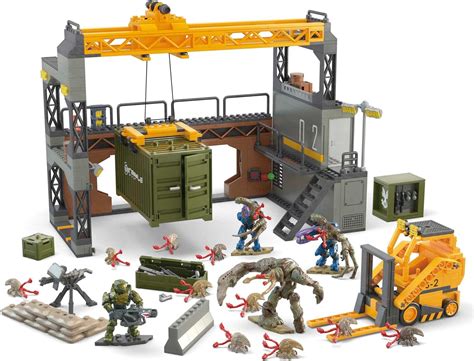 Fan-vote winning Halo Floodgate Firefight factory site building set inspired by Halo 3; This modular set can be configured 4 ways, and includes a forklift and crane with working winch; 4 highly detailed, super poseable micro action figures with swappable combat accessories 