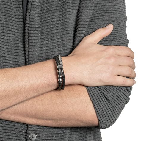 Men with bracelets. All Stacked Up Two-Tone Stainless Steel Chain Bracelet. $65.00. Textured Plaque Stainless Steel Chain Bracelet. $70.00. Braided Bracelet Brown and Black. $45.00. 3 Colors. 