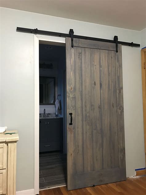 With a combination of metal and faux barn wood, the Shack door characterizes the industrial genre. It is sure to catch the eye of any guests in your home. This beautiful barn-style door is designed to be installed on a rail system (sold separately). Its production consists of a metal frame with aged vinyl wrapped wood-look inserts, giving it the appearance of a barn door. It requires no ...