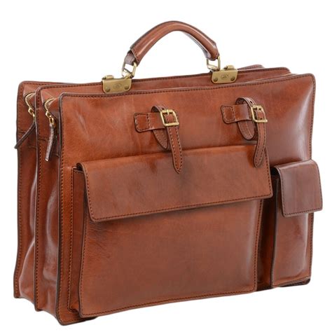 Mens leather work bag. It makes the garnet pull in awkward ways and isn't that flattering. With a suit jacket (or blazer) I'd strongly recommend a messenger bag. You can pick up moderately priced ones in canvas or leather off amazon. If your just wearing a button down/polo I think a modern backpack (think canvas & leather) looks professional. 