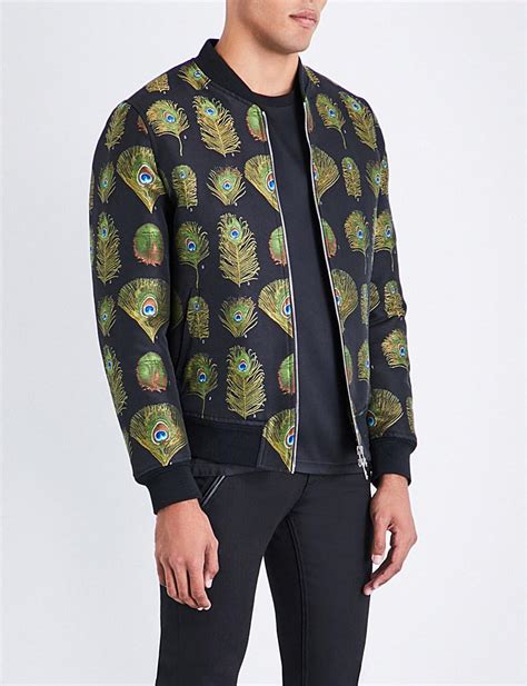 Mens peacock coat. Taking inspiration from the gorgeous patterns and colours of peacocks, this extraordinary embroidered coat epitomises winter glamour. Featuring a delicate peacock design and a luxe faux ... Our new Tailored Fit shirts offers a more tailored fit across the shoulders and sleeves than our Regular men's shirts. You will find the body is more ... 