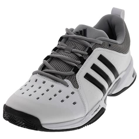 Mens wide tennis shoes. Tennis shoes are made of a combination of leather, rubber, plastic and canvas. The bottom sole of a tennis shoe is made of solid rubber, natural rubber or gum rubber. The rubber ba... 