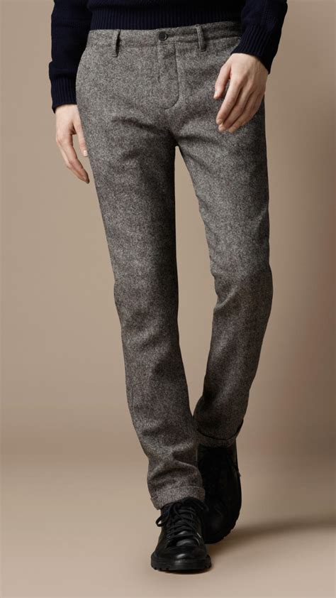 Mens wool trousers. Wool trousers are wonderful staples for cooler weather as they're similarly versatile and can function with a variety of casual outfits despite seeming more formal than in nature. They add warmth and comfort while being able to elevate your outfits with a more interesting pattern, texture, or material to the mix. 