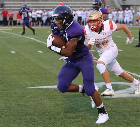 Merrillville quarterback Dontae Pope (1) gets past Valparaiso defenders to score the go-ahead touchdown during a Class 5A regional championship game in Merrillville on Friday, Nov. 10, 2023. Steve ...