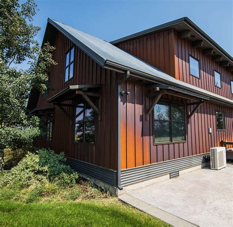 Metal siding house. Edco Dutchlap Siding. Carved rugged look of hand notched cedar planks with the strength of steel siding. Tough metal siding and soffit systems including traditional panels, specialty wall systems, heavy gauge soffit, residential lap siding, and metal shake siding. 