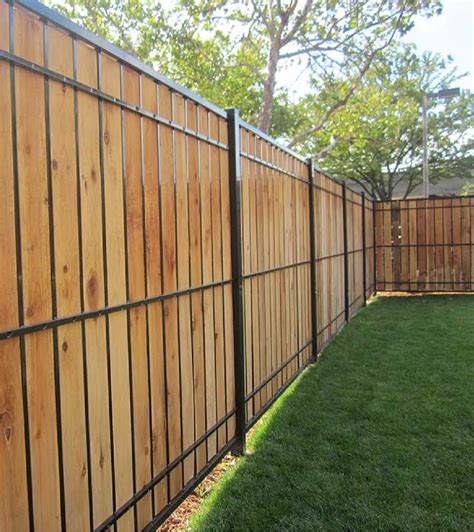 Metal wood fence. Step 2: Wrap the Posts. To conceal the metal posts, you can use special brackets to wrap them with the lumbar. Secure the brackets to each post, and screw two-by-fours to the … 