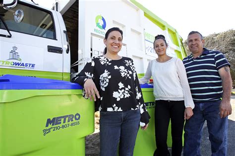 Metro waste. Metro Waste Systems founders Deborah (from left), Hector and Rachel Reyna stand near trucks used in their disposal business Tuesday at their offices on Texas 16 South in San Antonio. 