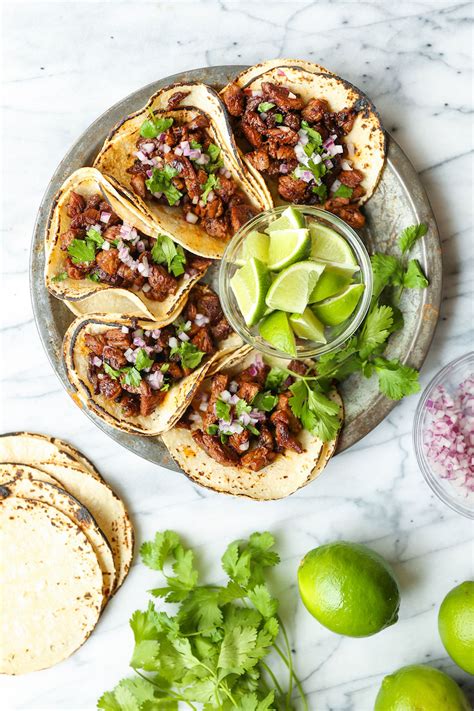 Mexican chicken street tacos. Arrange the chicken on top. Sprinkle taco seasoning over the chicken. Add the remaining tomatoes, chiles, and onions to the slow cooker. Cover the Crock Pot and cook the chicken on LOW for 4-6 hours or on HIGH for 2-3 hours. Remove the chicken to a cutting board and shred with two forks. 