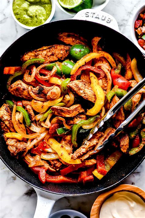 Mexican fajitas. Let the chicken cool slightly, then transfer to a cutting board and cut into ½-inch strips. Arrange the chicken and peppers on a serving platter. To warm the tortillas: stack 4-6 tortillas on a plate and cover them with a damp paper towel, then microwave for 30 seconds to 1 minute. Repeat with the remaining tortillas. 