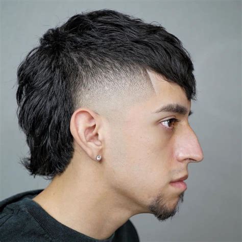 7. Baseball Haircut – High Upper Front Pomp with Duck Tail Style. Source. The ducktail style is something that we can often see among baseball players. While getting it, you may try going for a high upper front pomp as well. 8. Baseball Haircut – Hockey Hair with Bouncy Tail Mullet Hairstyle. Source.. 